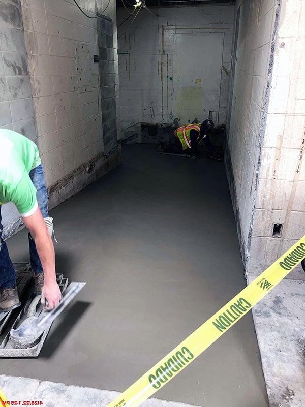 a worker is finishing concrete