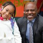 Superintendent Jones and a smiling student