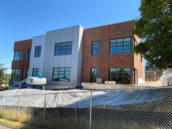 exterior of a two story brick and metal clad building