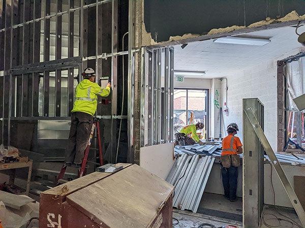 workers in a room under construction