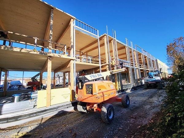 a 2 story building under construction with no walls