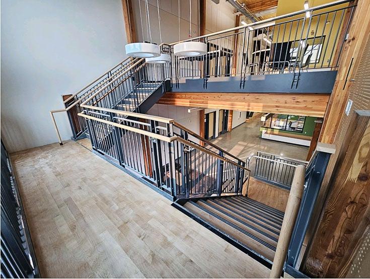 a stairway landing with stairs up to second floor and down to first floor