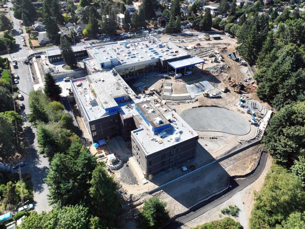 aerial of a large building with construction work happening