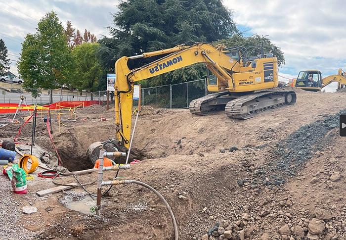 an excavator digging a hole