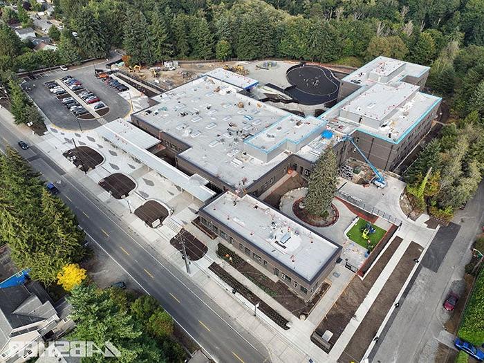 aerial view of a large building with trees