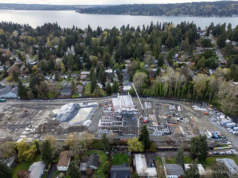 aerial of a building under construction with foundations for other parts surrounding it