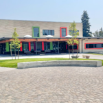 3 photos of newly completed school buildings