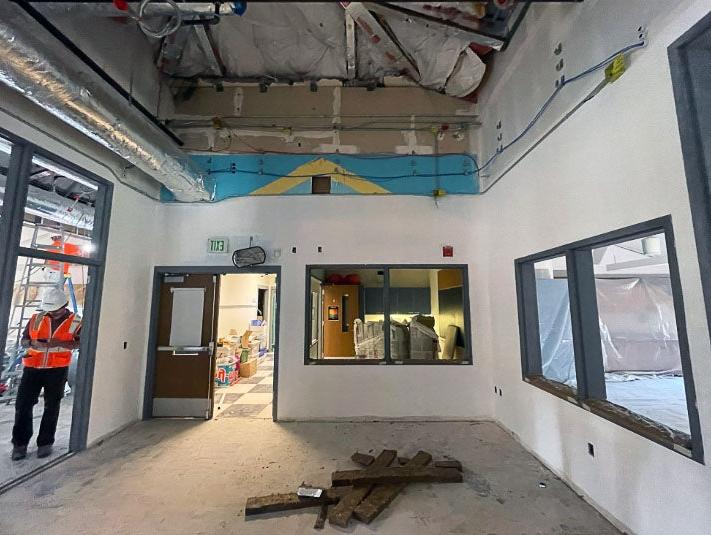 a hallway with an open ceiling under construction