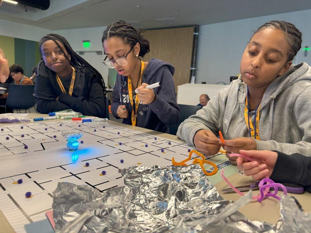 Students engineering robot add-ons for ozobot