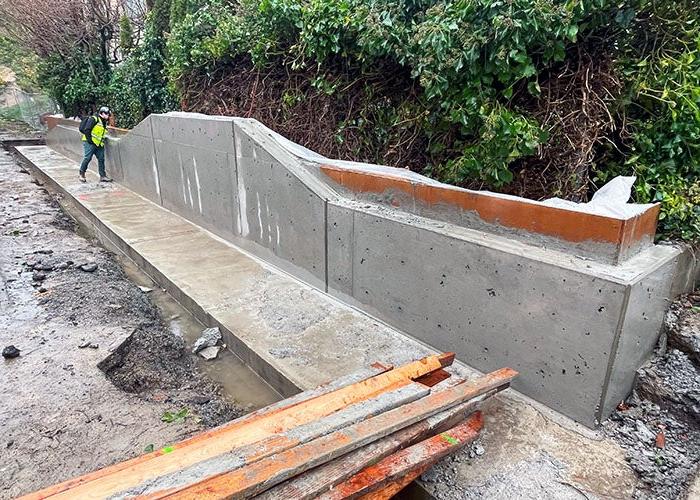 a concrete wall with a big footing