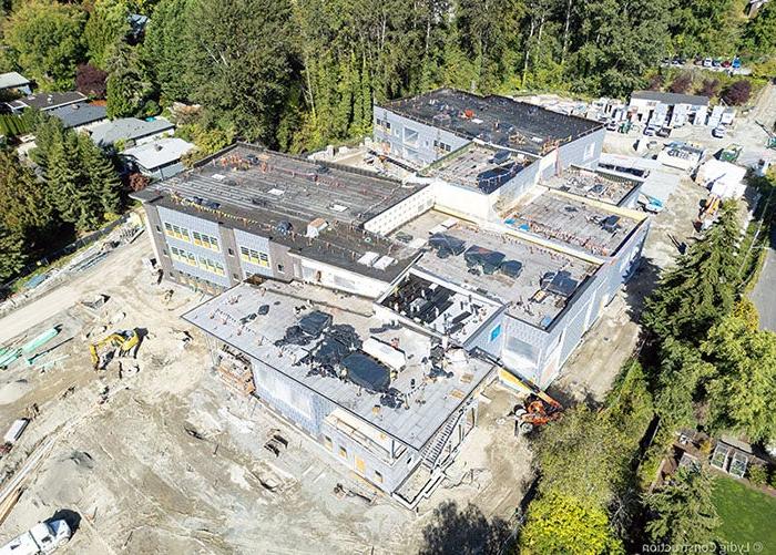 aerial of a building under construction with site equipment