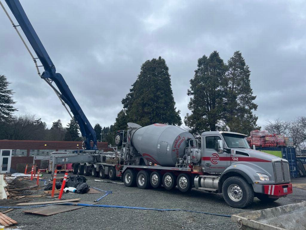 a concrete truck with a pump arm